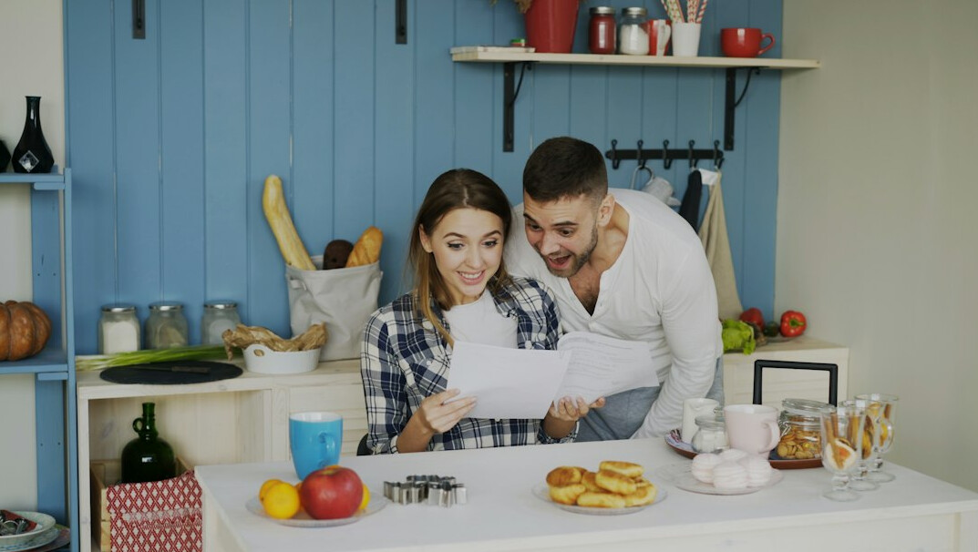 happy couple saving money